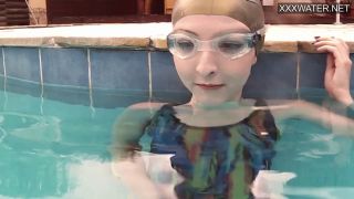 Brunette Emie Amfibia masturbates hard underwater-7