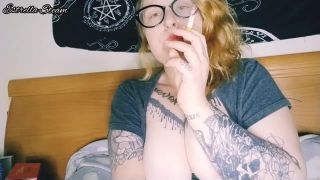 Estrella Steam smokes a cigar while playing with her tit.-5