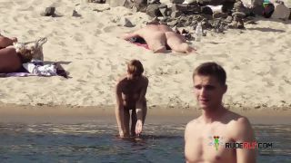 Long haired hottie lays around nude at the  plage-4
