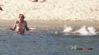 Long haired hottie lays around nude at the  plage-9