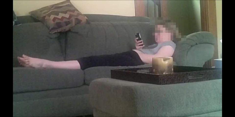 Horny girlfriend fingering pussy while watching phone porn on the couch. spy cam - Amateur