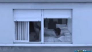 Mature couple fucking by the window-0