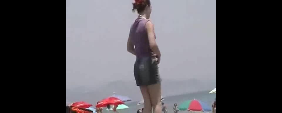 Sexy girl undresses at the  beach