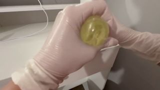 Dildo I give a handjob to the dildo with oily hands in medical white gloves-7