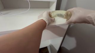Dildo I give a handjob to the dildo with oily hands in medical white gloves-8