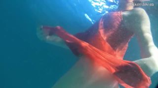 Rusalka Red dressed mermaid Rusalka swimming in the pool-0