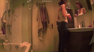 cute slim girl undressing and changing tampon in the bathroom. hidden ...-2