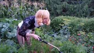 Pervert Sissy Kali takes care of her garden with an ass plug inside-2