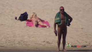 Amateur make fun at a nude beach  2-0