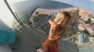 BEACH BUNNY GETS BENT OVER A PUBLIC BALCONY SWALLOWS Blowjob!-8