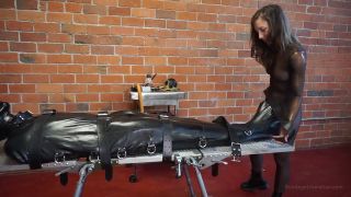BondageLiberationEliseGravesBagOfTricks-RuckusAndEliseGraves-SexyRuckusIsBoundInRubberSleepSack-2