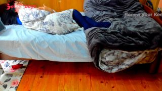 A busty Japanese woman masturbates with a beanbag cushion between her legs.-1