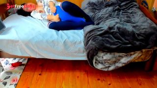 A busty Japanese woman masturbates with a beanbag cushion between her legs.-7