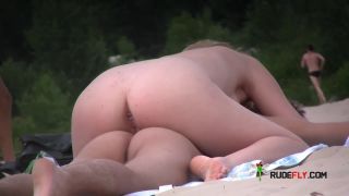Naughty teen shows off her privates on the sand  2-2