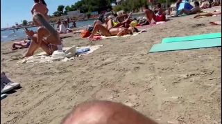 Making out while fingering her pussy on a public beach-1