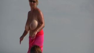 Gigantic mature tits on a beach Voyeur!-5