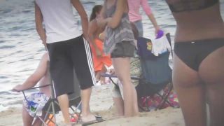 Silly blond girl gets dirty on beach-4