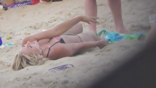 Silly blond girl gets dirty on beach-7