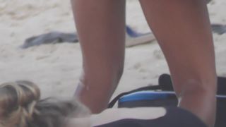 Silly blond girl gets dirty on beach-9