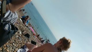 Generous nipple slip caught on the beach-2