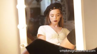 Kyra smoking in front ao a mirror.-4