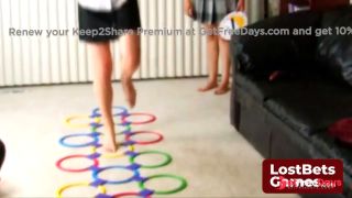Two women electrifying game of Stripscotch with energetic jumps-1