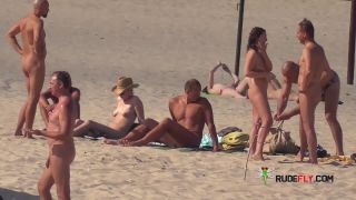 Slim girl with perky boobs naked at a nudist beach  3-7