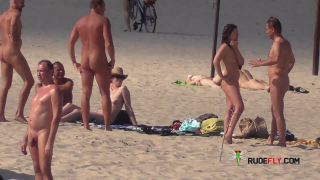 Slim girl with perky boobs naked at a nudist beach  3-9