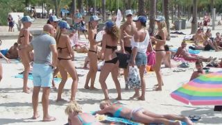 Club promoters dancing on beach-2