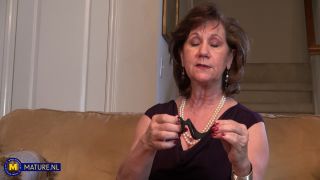 Mature.nl - Demi 63 - is a horny American grandma who loves to play with her shaved pussy - Red lips-1