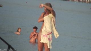 Pretty girl topless on the beach-1