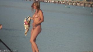 Pretty girl topless on the beach-8