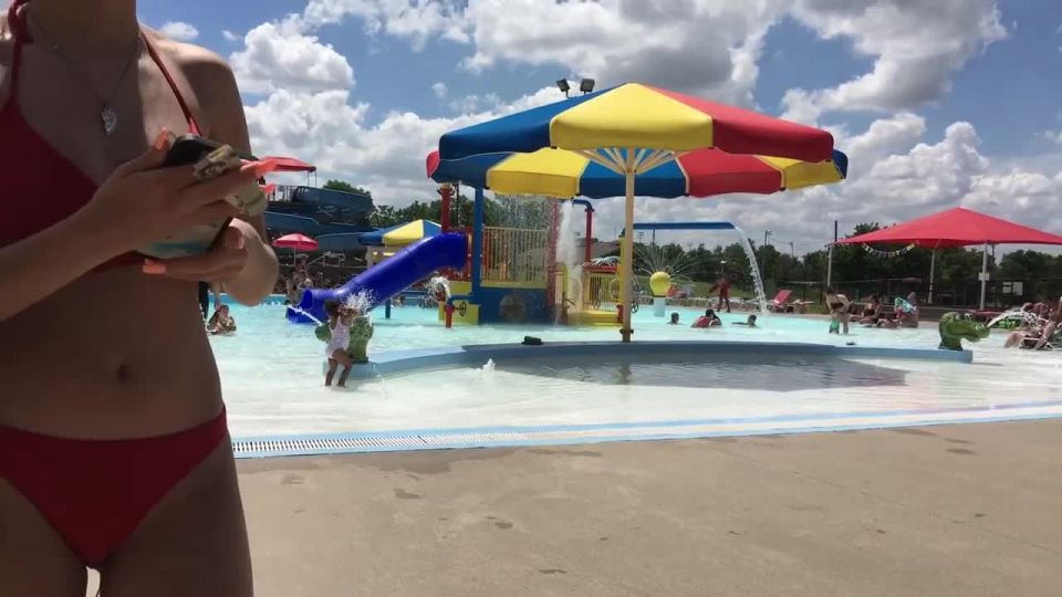 Sexy girl in red two piece bikini at the swimming pool