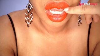Ebony MILF with red lips eats a fruit suggestively-1