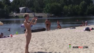 Teen nudists get naked and heat up a public  beach-1