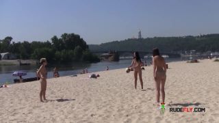 Teen nudists get naked and heat up a public  beach-6