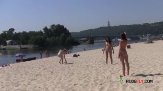 Teen nudists get naked and heat up a public  beach-7