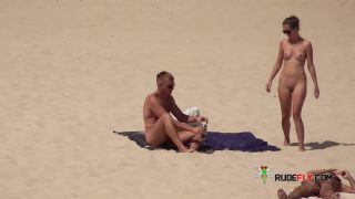 Dark haired naturist strand teen gets an all over  tan-0