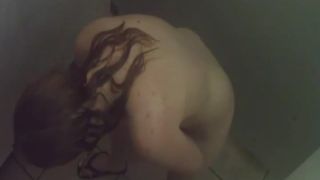 Ginger girl shaves armpits in a  shower-6