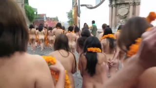 Public nudity with orange flowers on the street-7