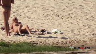 Two skinny naturist girls frolic around the strand-5